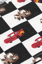 Checkered fabric with cartoon cars and trucks on a white and black checkered background